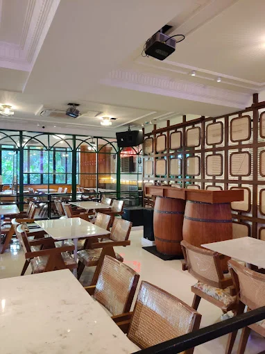 A detailed shot of the sophisticated brown leather booths and tables at The Studs - Sahakar Nagar.