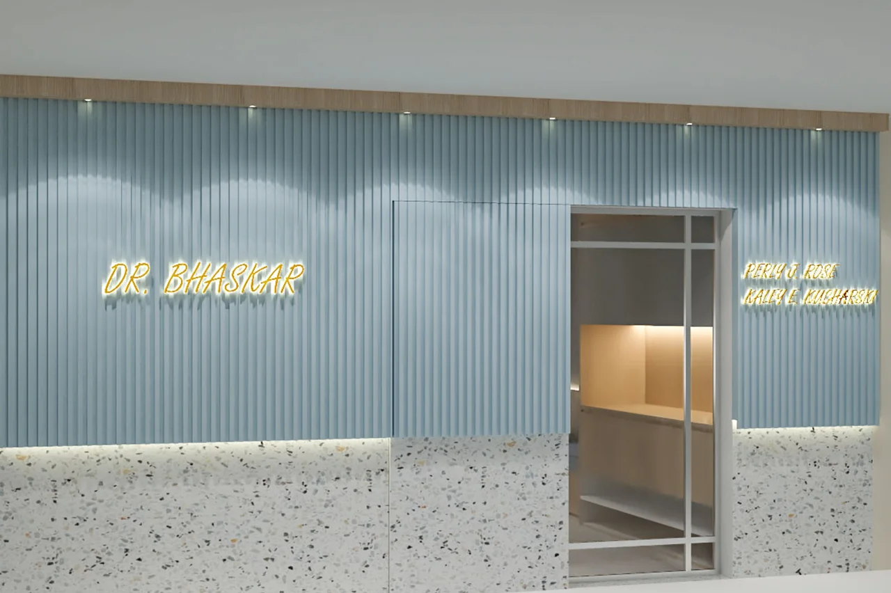 Clinic reception area with yellow neon sign, light blue fluted wall paneling, and white terrazzo-style counter design.