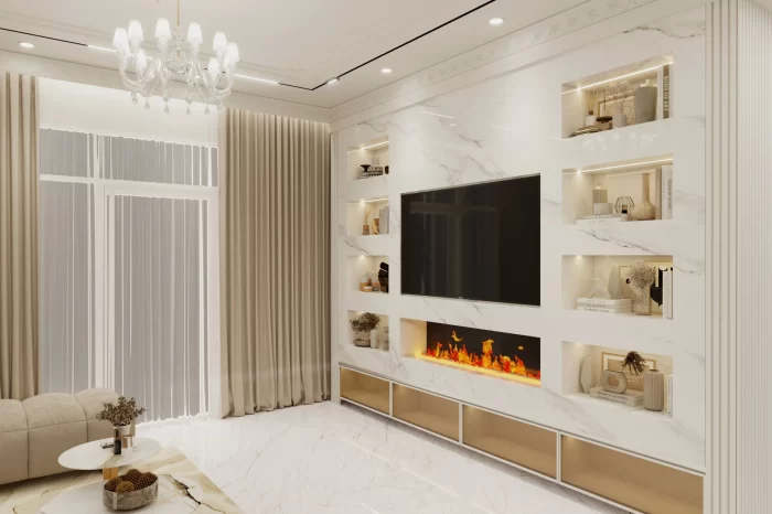 Feature TV media wall in white marble with integrated shelving, gold accents, linear electric fireplace, and concealed lighting.